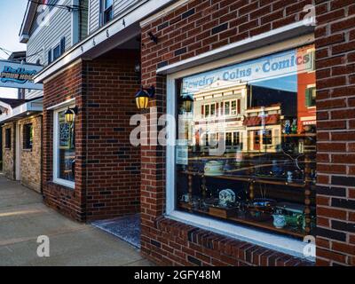 Brewerton, New York, USA. August 22,2021 .The small rural village of Brewerton, New York with store fronts and reflection on a quiet weekend morning Stock Photo