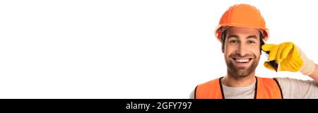 Smiling builder talking on mobile phone isolated on white, banner Stock Photo