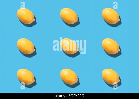 Fresh lemon lies on a blue background. Lemon pattern Stock Photo
