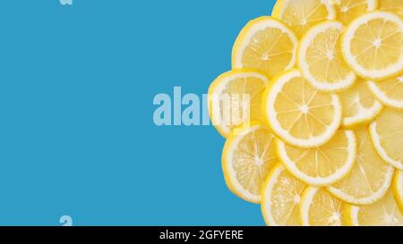 Fresh lemon lies on a blue background. Space for text Stock Photo