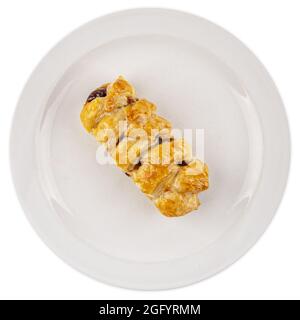Overhead shot of a stuffed braid bread on a plate isolated on white background Stock Photo