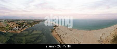 Panoramic aerial view of Praia da Fabrica, also known as Praia de Cacela Velha beach, a sandy barrier island at the mouth of the Ria Formosa in the Al Stock Photo