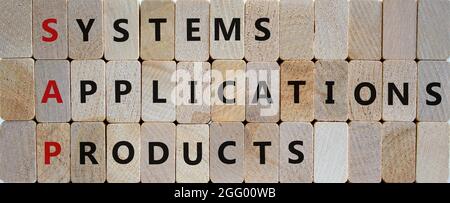 SAP, systems, applications, products symbol. Wooden blocks with words SAP, systems, applications, products. Wooden background, copy space. Business an Stock Photo