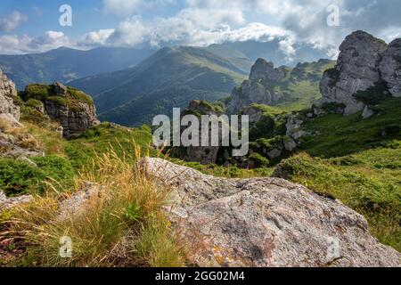 Landscape of Babin zub peak on Stara planina (Balkan mountains) in summer time. Track to highest point Midzor in Serbia in background Stock Photo