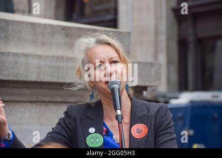London, United Kingdom. 27th August 2021. Extinction Rebellion co-founder Gail Bradbrook speaks to protesters outside The Royal Exchange, part of their Blood Money March targeting the City of London. (Credit: Vuk Valcic / Alamy Live News) Stock Photo
