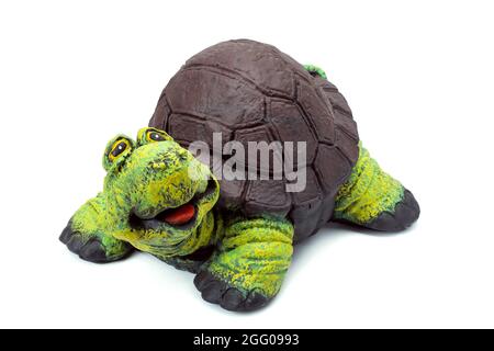 Concrete garden figure painted with colored paints, landscape object in the form of a cheerful turtle with a brown shell and a green head isolated on Stock Photo