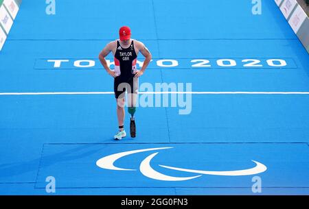 Great Britain's Michael Taylor crosses the line to finish eighth in the Men's PTS4 Triathlon at the Odaiba Marine Park during day four of the Tokyo 2020 Paralympic Games in Japan. Picture date: Saturday August 28, 2021. Stock Photo