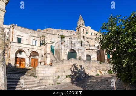 The bell tower of the Chiesa di San Pietro Barisano, or Church of Saint Peter, in the sassi district of the ancient city of Matera, Italy. Stock Photo