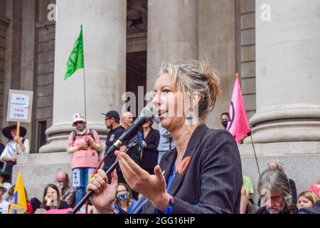 London, UK. 27th Aug, 2021. Extinction Rebellion co-founder Gail Bradbrook speaks to the protesters outside The Royal Exchange during the demonstration. Extinction Rebellion protesters staged the Blood Money March, part of their two-week Impossible Rebellion campaign, targeting the City of London, the capital's financial hub. Credit: SOPA Images Limited/Alamy Live News Stock Photo