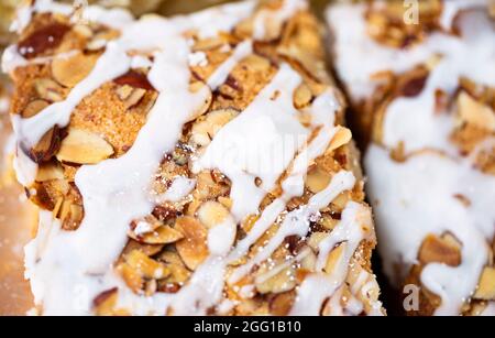 Dessert bread with white icing and nuts Stock Photo