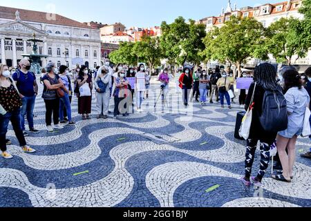 Lisbon, Portugal. 27th Aug, 2021. Activists gathering during the rally. The feminist collective, Por Todas Nos organized a rally in defense of Afghan women and children at Rossio Square, and presented an initiative that was signed by 18 groups and associations and has more than 150 individual signatures proposing to increase the quota of refugees. At the rally, testimonies of women from Afghanistan were read. Credit: SOPA Images Limited/Alamy Live News Stock Photo