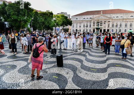 Lisbon, Portugal. 27th Aug, 2021. An activist makes a speech of testimony to colleagues, during the rally. The feminist collective, Por Todas Nos organized a rally in defense of Afghan women and children at Rossio Square, and presented an initiative that was signed by 18 groups and associations and has more than 150 individual signatures proposing to increase the quota of refugees. At the rally, testimonies of women from Afghanistan were read. (Photo by Jorge Castellanos/SOPA Images/Sipa USA) Credit: Sipa USA/Alamy Live News Stock Photo