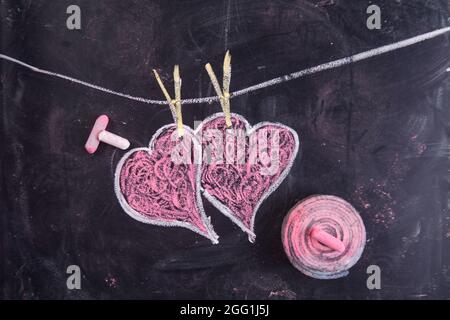 Done graphical representation with chalk on blackboard symbol of love, the heart Stock Photo