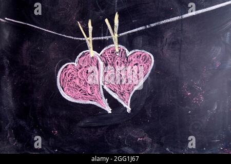 Done graphical representation with chalk on blackboard symbol of love, the heart Stock Photo