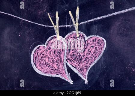 Done graphical representation with chalk on blackboard symbol of love, the heart Stock Photo