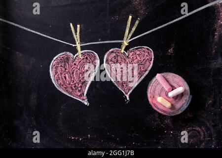 Done graphical representation with chalk on blackboard symbol of love, the heart Stock Photo