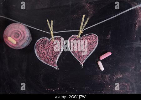 Done graphical representation with chalk on blackboard symbol of love, the heart Stock Photo