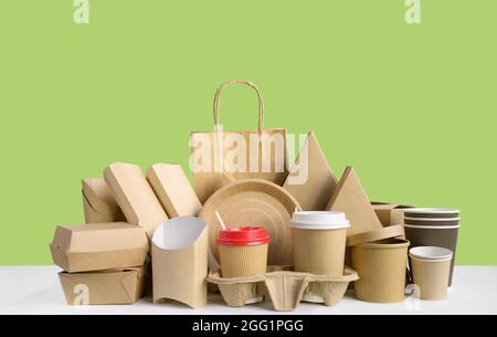 Fast food packaging from eco friendly paper isolated on green. Stock Photo