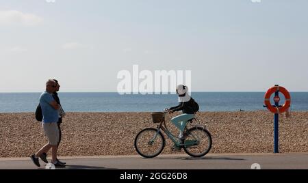 People Seen Walking Along The Beach Towards A Safe Zone During The people-seen-walking-along-the-beach-towards-a-safe-zone-during-the