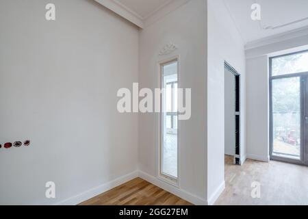 empty white room with repair and without furniture with panoramic windows Stock Photo