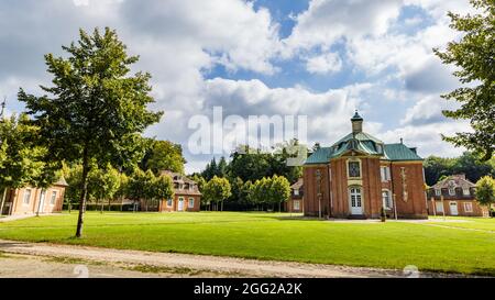 Sogel, Germany - August 25, 2021: Landscape with main building and guest lodges of castle Clemenswerth in Sogel Lower Saxony in Germany Stock Photo
