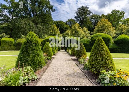 Sogel, Germany - August 25, 2021: Landscaped cloister garden at castle Clemenswerth in Sogel Lower Saxony in Germany Stock Photo