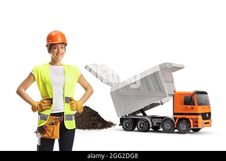 Female construction worker and a truck unloading debris isolated on white background Stock Photo
