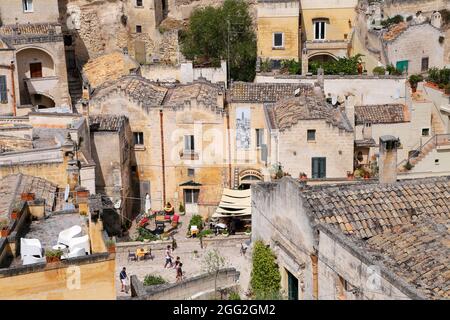 Matera, Italy - August 18, 2020: View of the Sassi di Matera a historic district in the city of Matera, well-known for their ancient cave dwellings. B Stock Photo