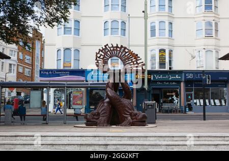 England, East Sussex, Brighton, Norfolk Square, Waves of Compassion Sculpture created by Steve Geliot, formed of three original Old Steine dolphins. Stock Photo