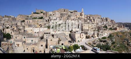 Matera, Italy - August 17, 2020: View of the Sassi di Matera a historic district in the city of Matera, well-known for their ancient cave dwellings. B