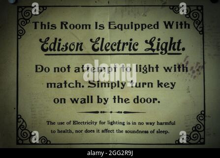 Detail at a Westport shop: a historic instruction label for the first adopters of Edison's electric light: Do not attempt to light with match! Stock Photo