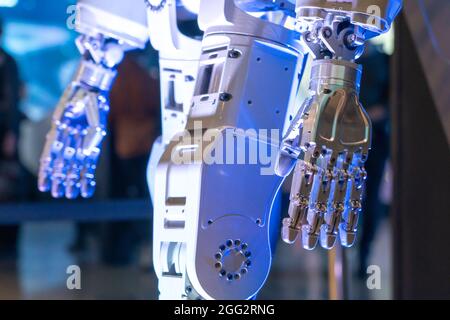 Closeup of metal robot hand. Concept of modern technology. Blue tone Stock Photo