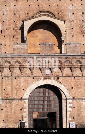 Porta Ovile, Imposing city gate from the 13th century with a curved arch and battlements, Siena, Tuscany, Italy Stock Photo