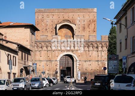 Porta Ovile, Imposing city gate from the 13th century with a curved arch and battlements, Siena, Tuscany, Italy Stock Photo