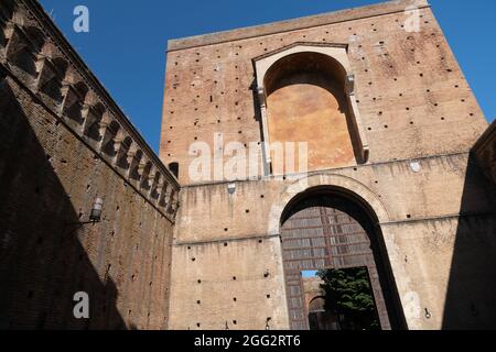 Porta Ovile, Imposing city gate from the 13th century with a curved arch and battlements, Siena, Tuscany, Italy Stock Photo