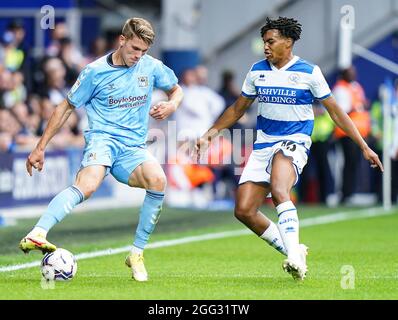 Coventry City's Viktor Gyokeres (left) and Queens Park Rangers' Sam McCallum (right) battle for the ball during the Sky Bet Championship match at the Kiyan Prince Foundation Stadium, London. Picture date: Saturday August 28, 2021. Stock Photo
