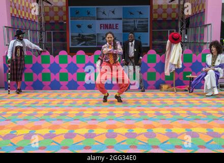 london UK 28 August 2021 The Sappeurs of Brazzaville and Kinsasha  dancing group ,unique fashion style  and flamboyance Part of the Greenwich and Dockland International Festival 2021 Paul Quezada-Neiman/Alamy Live News Stock Photo