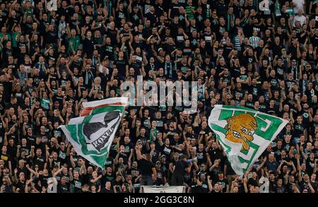 BUDAPEST, HUNGARY - AUGUST 4: Ultras of Ferencvarosi TC support their team during the UEFA Champions League Third Qualifying Round 1st Leg match between Ferencvarosi TC and SK Slavia Praha at Ferencvaros Stadium on August 4, 2021 in Budapest, Hungary. Stock Photo