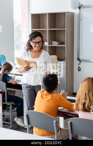 Smiling Schoolgirls Holding Digital Tablet With Blank Screen Isolated 