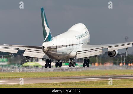 Cathay Pacific Cargo Boeing 747 freighter Jumbo Jet airliner jet plane landing at London Heathrow Airport, UK, about to touch down on runway Stock Photo