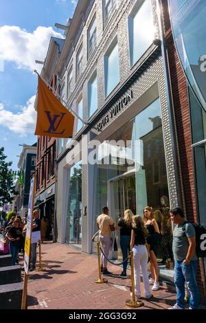 Amsterdam, Holland, Street Scenes, Row Luxury Shops, Townhouses in Old Town Historical Neighborhood, Prestige consumer, row of shops fronts, Louis Vuitton, LVMH, teenagers netherlands Stock Photo