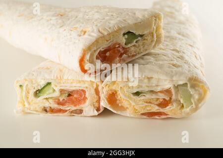 thin flour rolls stuffed with seafood and vegetables Stock Photo