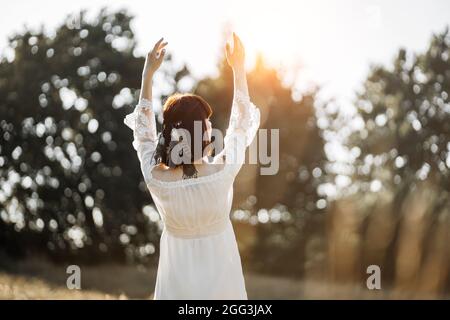 Outdoor portrait of the charming young boho (hippie) girl in