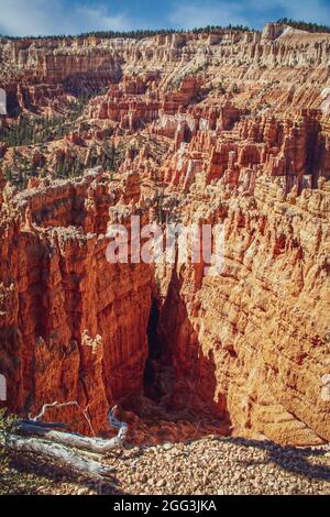 Looking down into Bruce Canyon Urah USA at cliffs and hoodoos in bright sunlight with dramat Stock Photo