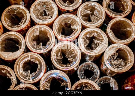 Top view of plastic wrapped Christmas wrapping paper rolls on display Stock Photo