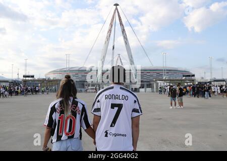 Turin, Italy, 28th August 2021. Juventus fans approach the stadium wearing jerseys bearing the names of Alessandro Del Piero and Cristiano Ronaldo prior to the Serie A match at Allianz Stadium, Turin. Picture credit should read: Jonathan Moscrop / Sportimage Stock Photo