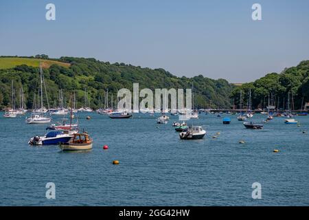In the middle background, the stretch of water known as Pont Pill, an estuary off the River Fowey - taken from Fowey, south Cornwall, UK. Stock Photo