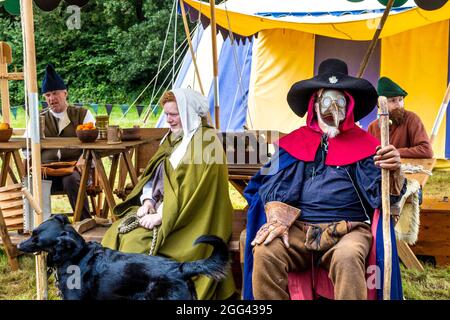 8th August 2021 - Man dressed up as plague doctor, wearing beaked mask at Mediaval festival Loxwood Joust, West Sussex, England, UK Stock Photo