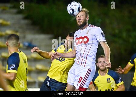 Union's Guillaume Francois and Standard's Joao Klauss De Mello fight for the ball during a soccer match between Royal Union Saint-Gilloise and Standar Stock Photo