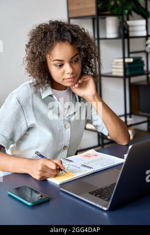 African American student girl having video call videoconference on laptop. Stock Photo